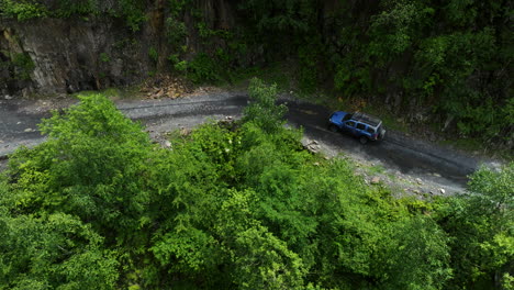 Aerial-View-Of-Off-road-SUV-Vehicle-Driving-On-Dirt-Road-Of-Abano-Pass-At-Summer-In-Georgia