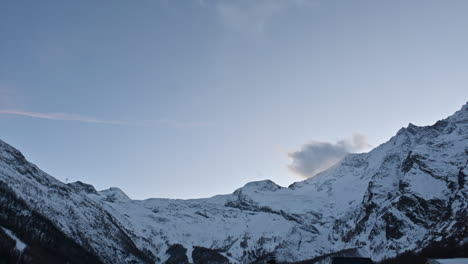 Timelapse:-moving-clouds-over-the-Swiss-alps,-mountain-range,-rocky-summits-in-Saas-Fee