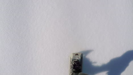 Closeup-shot-of-a-person-snowshoeing-up-into-the-snow-covered-mountains-of-Kodiak-Island-Alaska