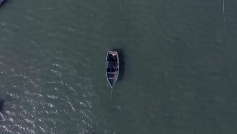 Drone-aerial-shot-of-boats-floating-in-the-sea-during-the-day