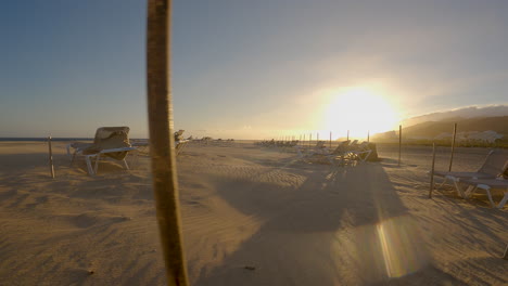 Empty-Sun-Loungers-On-Sandy-Beach-In-Fuerteventura,-Canary-Islands,-Spain