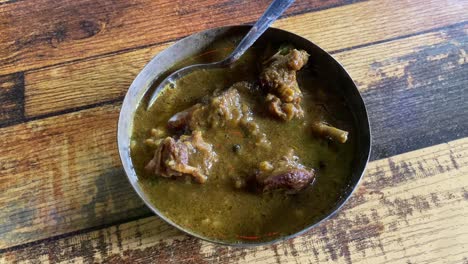 Mutton-curry,-also-known-as-lamb-curry,-goat-curry,-or-kosha-mangsho,-is-a-meal-that-is-typically-served-with-rice-or-Indian-breads-like-naan-or-parotta
