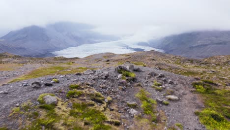 Reveal-shot-of-shrinking-glacier-in-Iceland-on-cloudy-day
