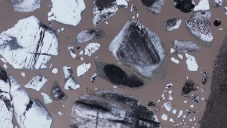 Top-down-of-melting-icebergs-in-glacial-lagoon,-global-warming