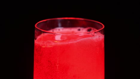 Ice-cubes-falling-in-a-red-light-juice-1