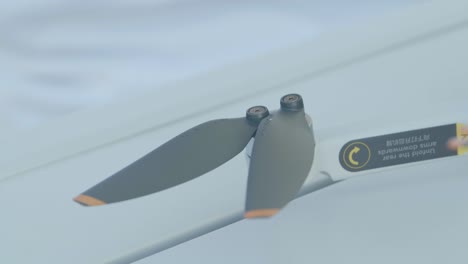Detail-of-a-drone-propeller-being-mounted,-slow-motion,-close-up