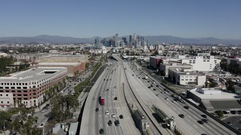 Time-lapse-establishing-aerial-view-downtown-Los-Angeles-with-freeway