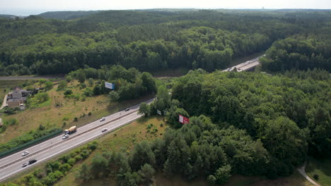 Asphalt-Highway-With-Daytime-Traffic-Through-Forested-Landscape-In-Gdynia,-Poland