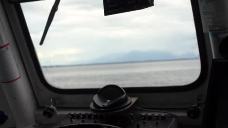 Boat-Captain-piloting-ship-to-shore