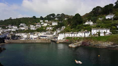 Polperro,-panning-shot-showing-a-small-and-quaint-fishing-village-in-Cornwall,-England
