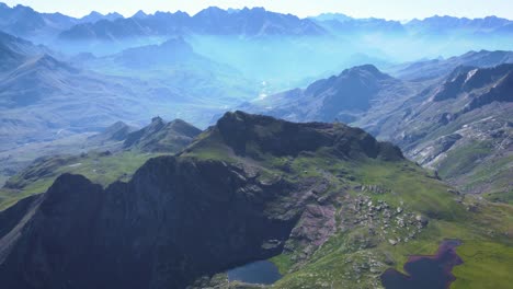 Aerial-view-of-Anayet-mountain-range-peak-and-lake-in-Spanish-and-french-Pyrenees-in-Summer-morning-1