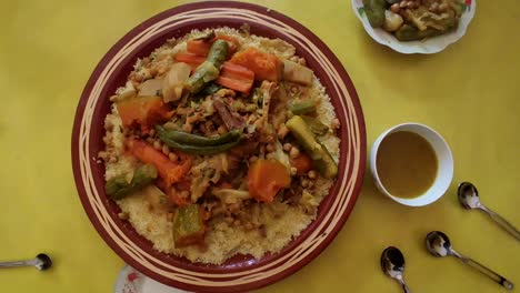 Couscous-meal-with-meat-and-vegetables-in-a-traditional-Arabic-plate-,Morocco-