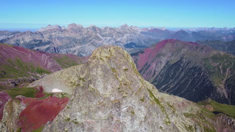 Aerial-view-of-Anayet-mountain-range-volcanic-peak-and-red-landscape-in-Spanish-and-french-Pyrenees-in-Summer-morning