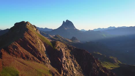 Ascending-drone-Morning-sunrise-in-Anayet-mountain-lake-range-and-peak-in-Spanish-Pyrenees-during-summer-morning