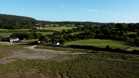 Aerial-view-across-Traeth-Coch-Pentraeth-Welsh-rural-marshland-scenic-farming-countryside-at-sunset
