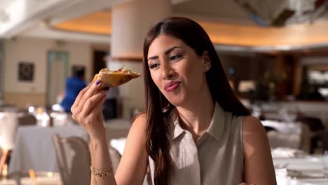 Beautiful-woman-eating-and-enjoying-a-slice-of-pizza-50FPS