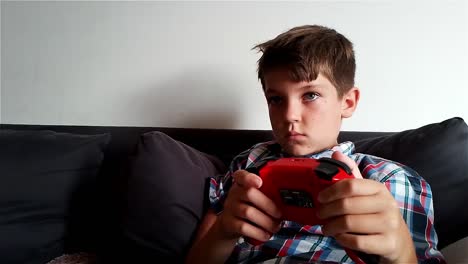 Boy-Is-Playing-Video-Game-On-Nintendo-Switch-Gaming-Console