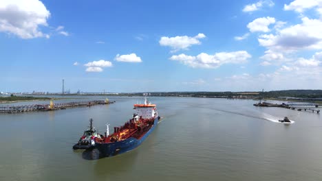 Shipping,-bulk-carrier-sailing-up-the-Thames-river,-London