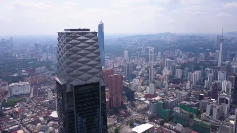 Drone-shots-of-Kuala-Lumpur-skyline-with-skyscrapers,-Malaysia,-UHD-2