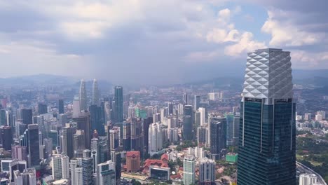 Drone-shots-of-Kuala-Lumpur-skyline-with-skyscrapers,-Malaysia,-UHD-1