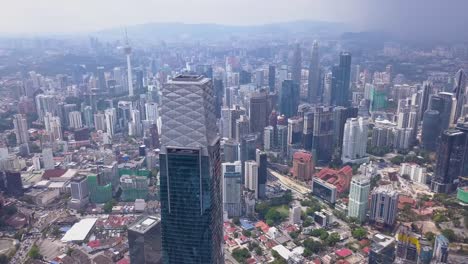 Drone-shots-of-Kuala-Lumpur-skyline-with-skyscrapers,-Malaysia,-UHD