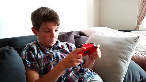 Boy-Is-Gaming-Video-Game-On-Nintendo-Switch-Gaming-Console