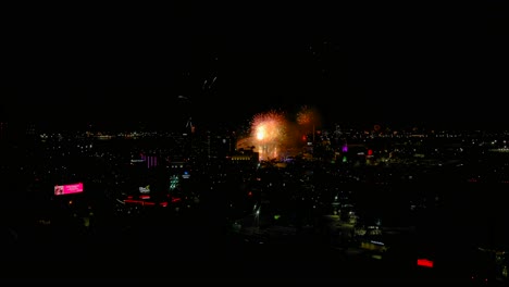 Zoom-In-Drone-Shot-of-colorful-fireworks-from-New-Years