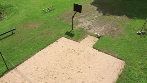 Empty-rural-basketball-and-volleyball-court,-aerial-view