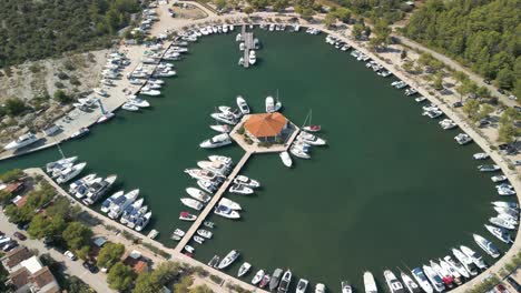 Aerial-footage-with-drone-circling-over-a-small-marina