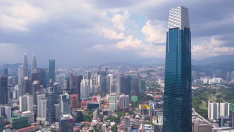 Drone-shots-of-Kuala-Lumpur-skyline-with-skyscrapers,-Malaysia,-UHD-4