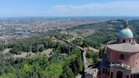Aerial-shot-revealing-Santuario-di-San-Luca,-Sanctuary-in-Bologna,-Curch-in-Italy,-with-a-view-of-the-arcade-and-the-city-in-the-background