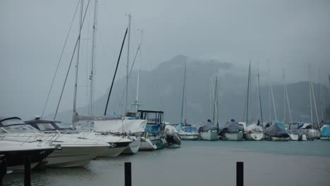Mountain,-windy,-fog,-boats,-lake,-rain,-cloudy,-moody,-switzerland,-early-morning,-hergiswil,-harbor,-europe