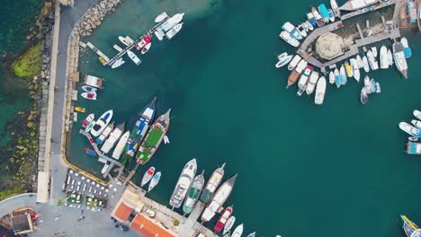 Aerial-zoom-out-of-the-port-of-Girne-in-Cyrpus-with-aqua-sea