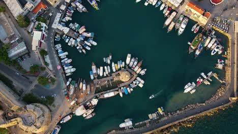 Top-down-aerial-shot-harbor-in-Girne,-Cyprus-with-boats-and-the-castle