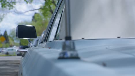 Vintage-car-blue-Mercury-side-view-mirror-and-antena