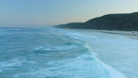 Ocean-Waves-Drone-areal-shot-at-Blue-Hour,-Double-Island-Point,-Australia