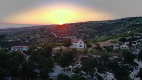 Aerial-of-a-lonely-house-during-sunset-in-Troodos-mountains,-Cyprus