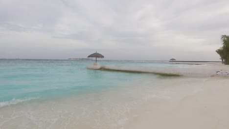 Drone-shot-of-breaking-waves-at-Maldives-sea-shore