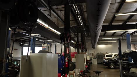 Car-repair-garage-air-ducts,-panning-shot