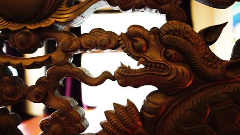 Close-up-gimbal-shot-of-Vietnamese-ancient-wood-carvings