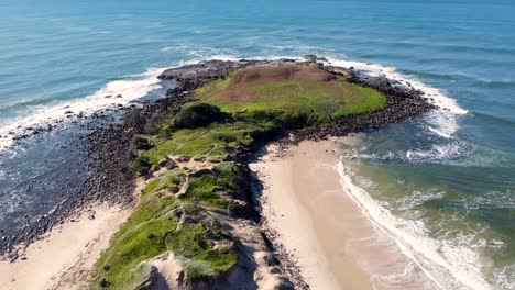 Drone-aerial-pan-shot-of-nature-scenic-Island-beach-reef-break-sandy-rocky-travel-tourism-Yamba-Ballina-North-Coast-NSW-Australia-4K