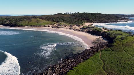 Drone-aerial-pan-shot-National-park-scenic-landscape-beach-view-tourism-travel-sand-dunes-rocks-Yamba-Angourie-NSW-North-Coast-Australia-4K