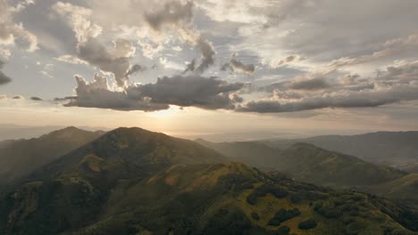 Aerial-of-backcountry-mountain-range-at-sunset-with-beautiful-cloud-formation-after-a-storm-2