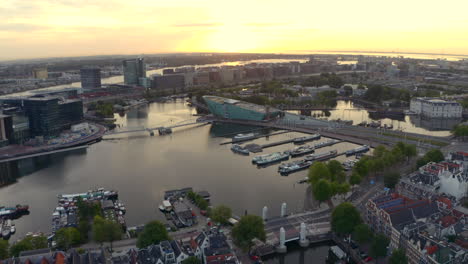 Drone-shot-towards-Nemo-Science-museum-Oosterdok-Amsterdam-at-sunrise