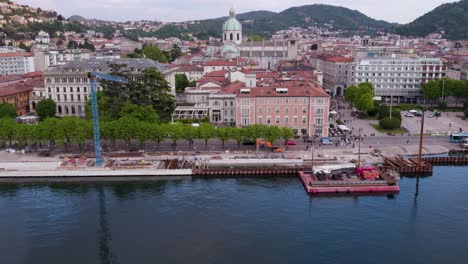 Como-Italy-Lakefront-Drone-View-of-Barrier-Water-Defences-and-Walkway-Construction-Site---tilting-up-establishing-shot