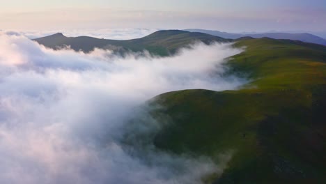 Cloud-Shrouded-Mountain-Hills-At-Sunset,-Drone-Shot-Over-Foggy-Valley