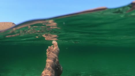 Feet-swimming-in-the-mediterranean-sea