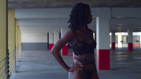 Sexy-lingerie-outfit-worn-by-a-young-black-female-in-a-parking-garage