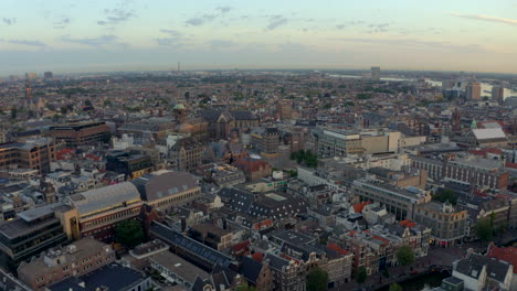 Drone-shot-towards-Dam-Square-central-Amsterdam-at-sunrise