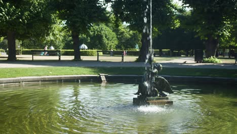 Fountain-of-a-boy-fighting-a-swan-in-Kongens-Have-in-Copenhagen,-Denmark